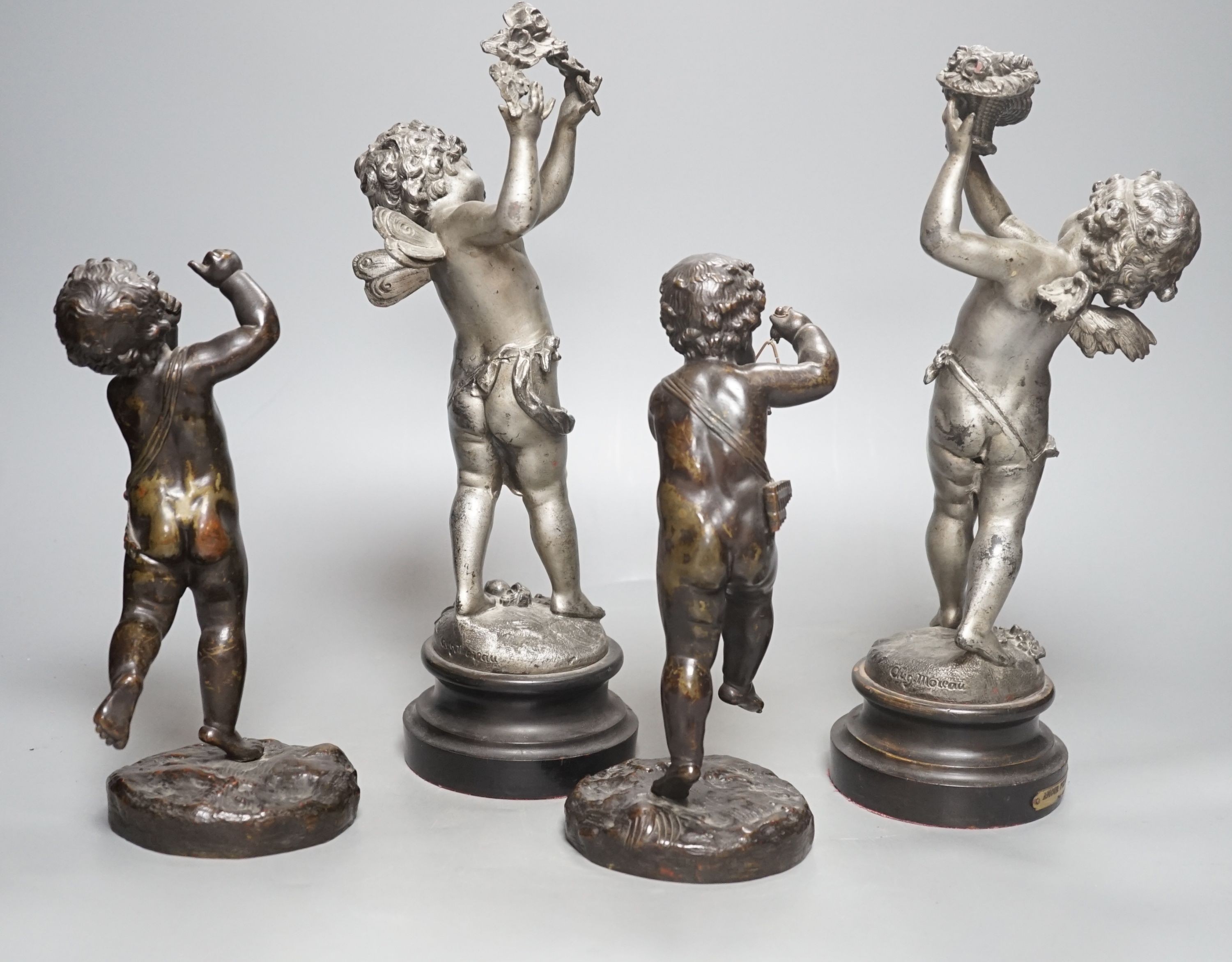 A pair of bronze musical putti and a pair of seasonal spelter putti - tallest 32cm